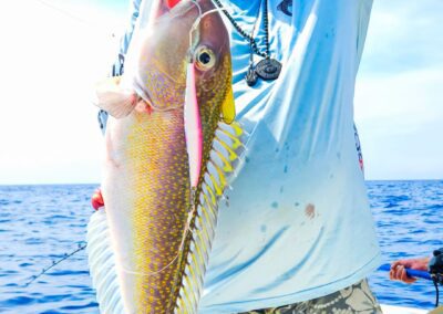 a person holding a fish